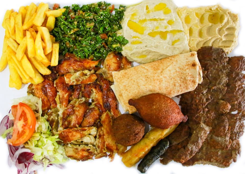 Shawarma Yaser mixed grill plate with pita, fries, and salad